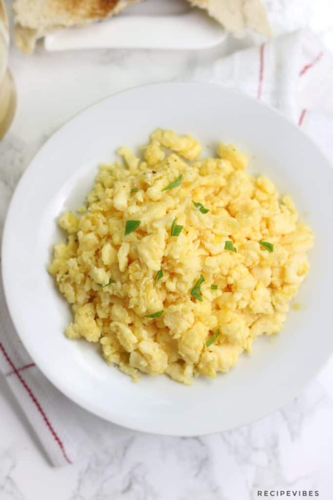 Instant pot scrambled eggs served on a white plate