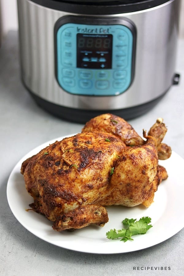 instant pot whole chicken on white plate
