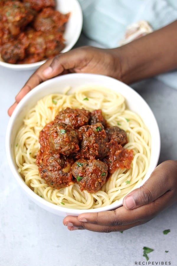 Spaghetti and meatball served in white plate
