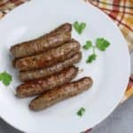5 Instant pot Italian sausages on white plate