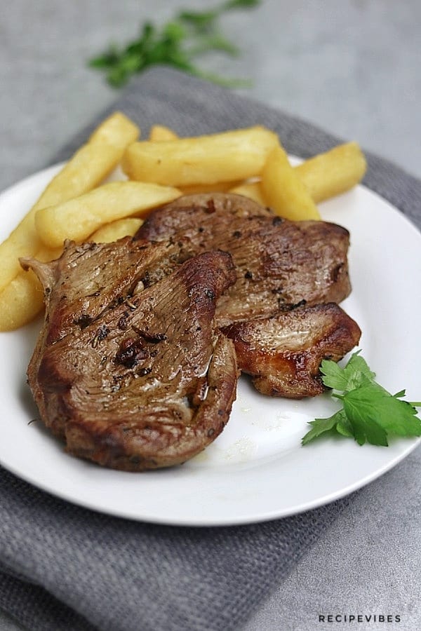 juicy steak on white plate