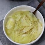 Instant pot cabbage in white bowlon grey background