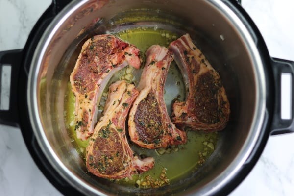 lamb chops in instant pot. brown the sides for 2 minutes.