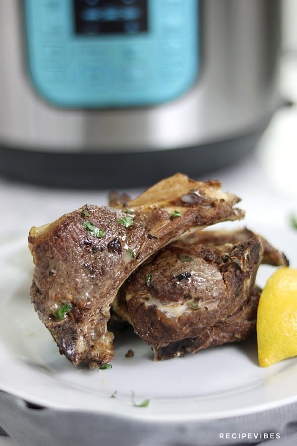 instant pot lamb chops pictured with instant pot at the background