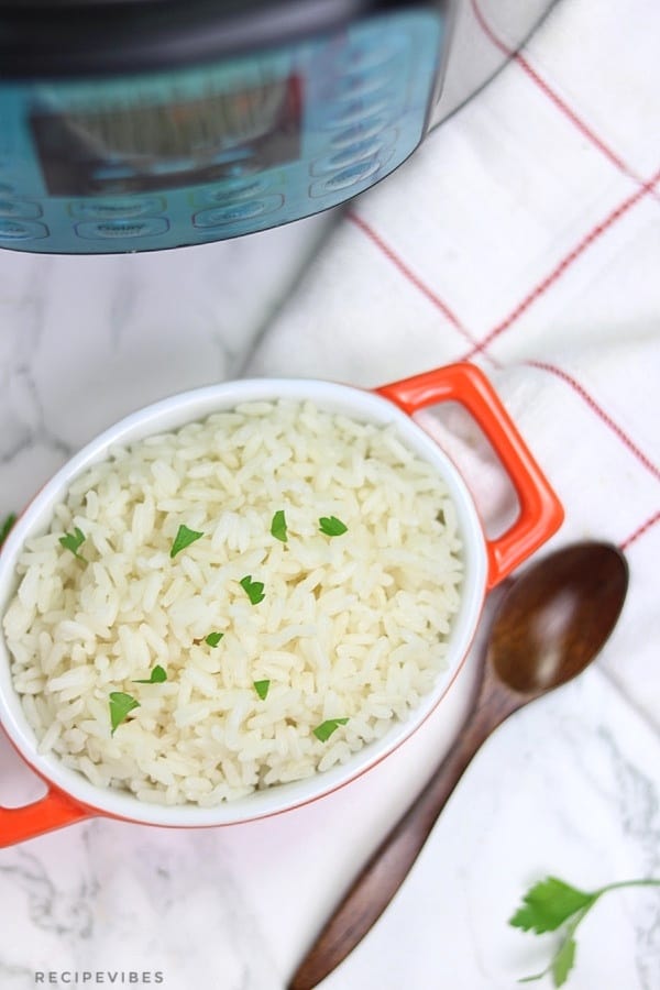 Instant pot white rice in orange bowl