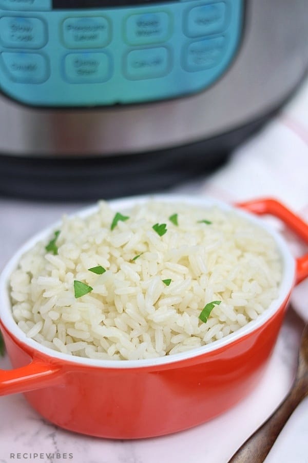 instant pot white rice in bowl with instant pot at the background