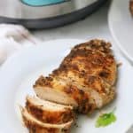 Instant Pot Chicken Breast sliced up in a white plate