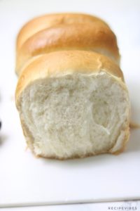 homemade bread on white cutting board