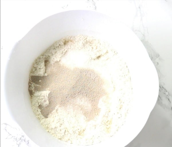 flour, yeast, sugar and salt in mixing bowl