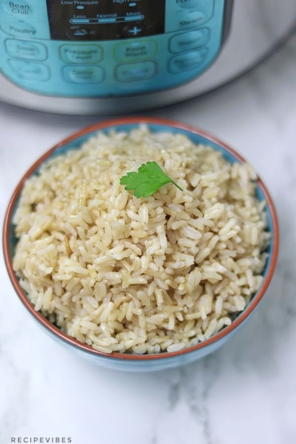 instant pot brown rice served in blue bowl