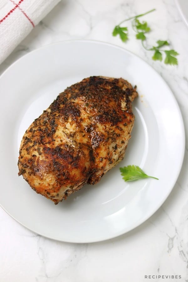 Instant pot chicken breast served on white plate 