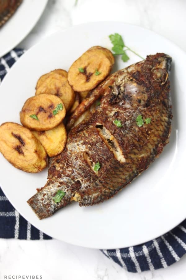 pressure cooker steamed Whole fish served with plantain