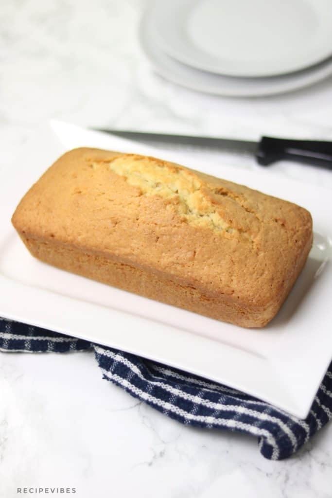 Madeira cake loaf in white rectangular plate