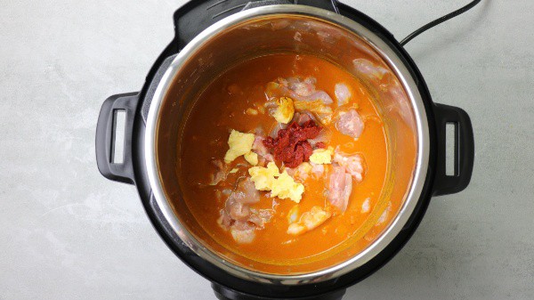 add tomato paste, butter and all other ingredients in the pot