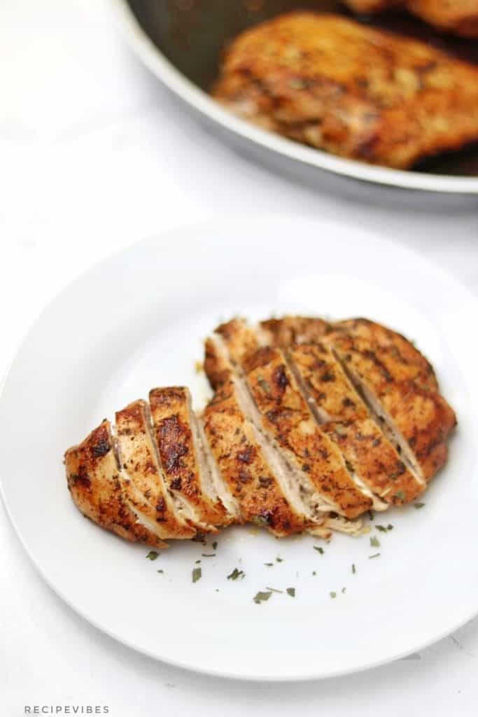 stovetop chicken breast served on white plate