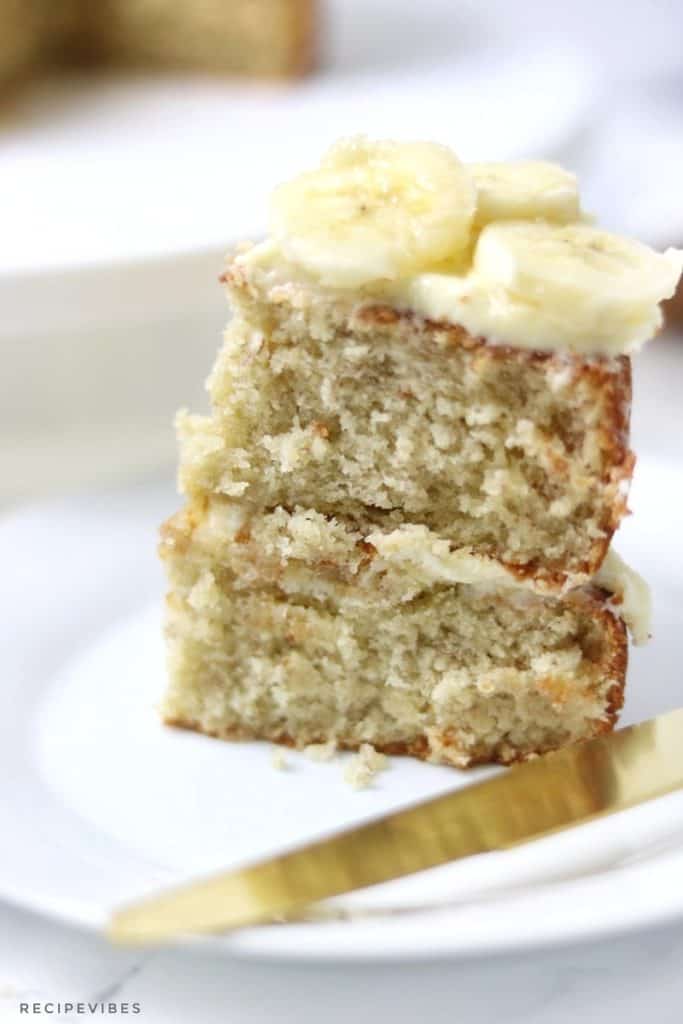 topped with frosting and sliced bananas