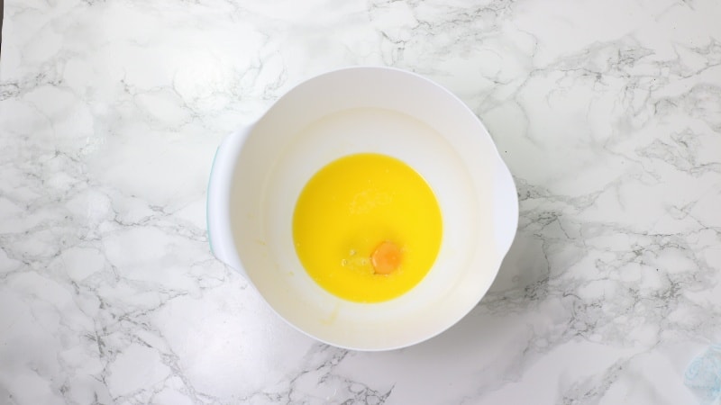 egg, butter and milk in mixing bowl