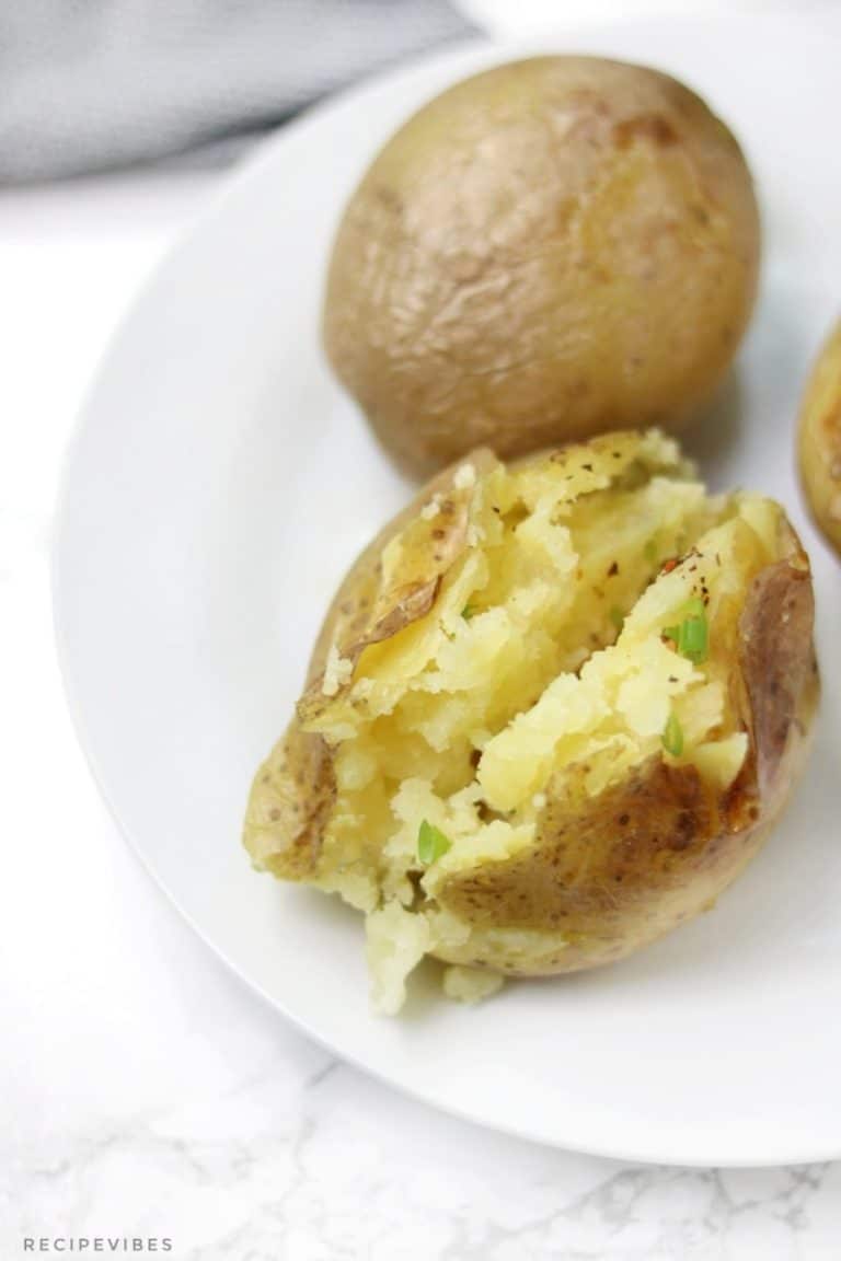 Instant pot baked potatoes on white plate