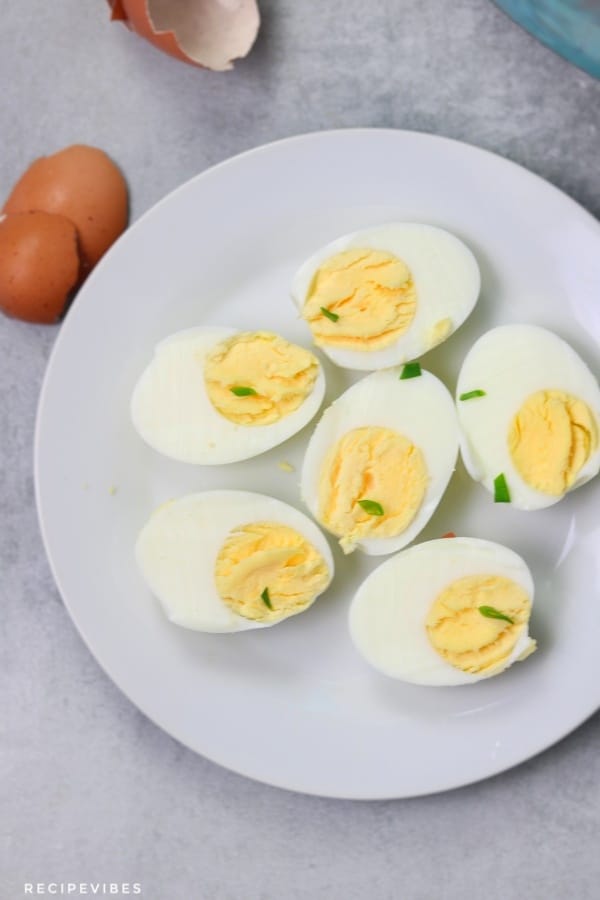 Hard boiled eggs garnished with spring onions