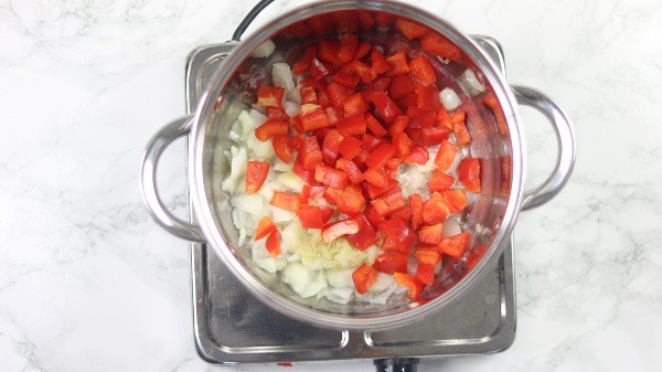 onion, garlic and bell peppers inside pot