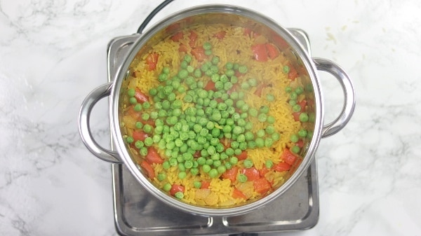 picture showing peas added in the rice