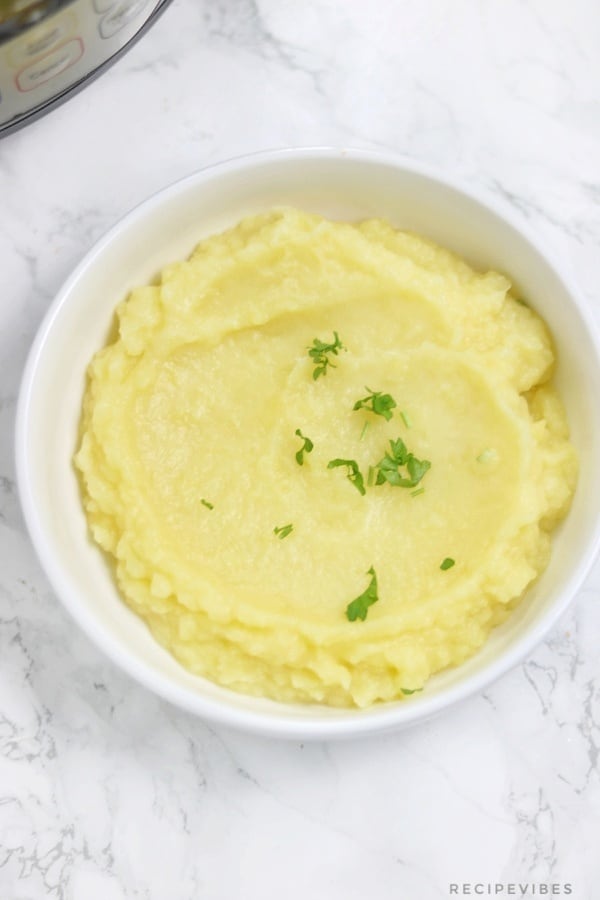 Instant pot mashed potatoes served on white plate