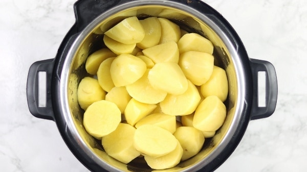 peeled potatoes inside pressure cooker