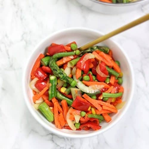 finished dish served in plate with gold spoon in the plate