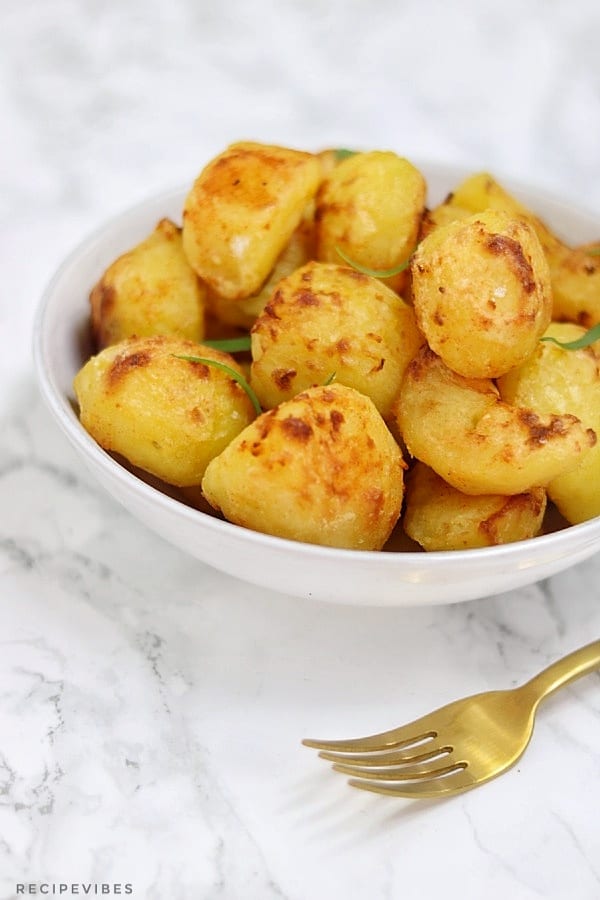 Perfect roast potatoes served in a white bowl