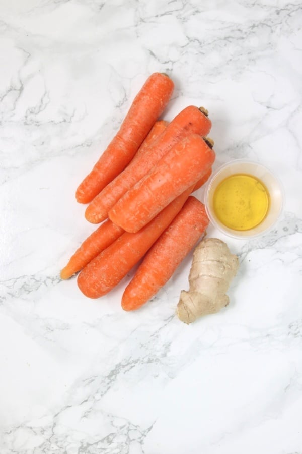 a picture of carrots, ginger and honey