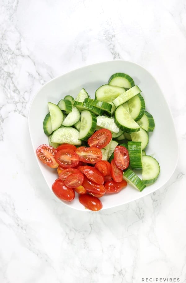 cucumber and tomatoes in salad bowl