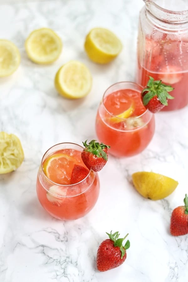 strawberry lemonade served in 2 glass cups
