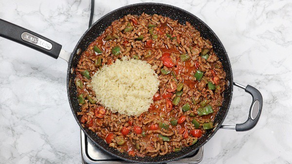 rice added in the ground beef sauce.