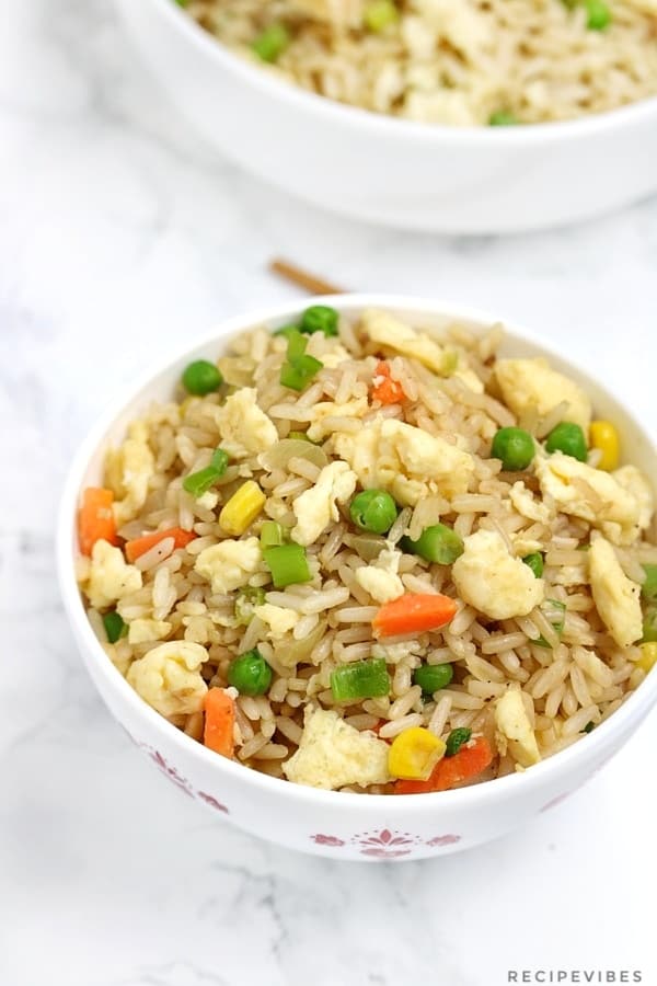 egg fried rice in a white bowl.