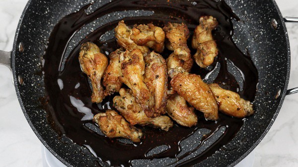 chicken wings added into the honey soy sauce.