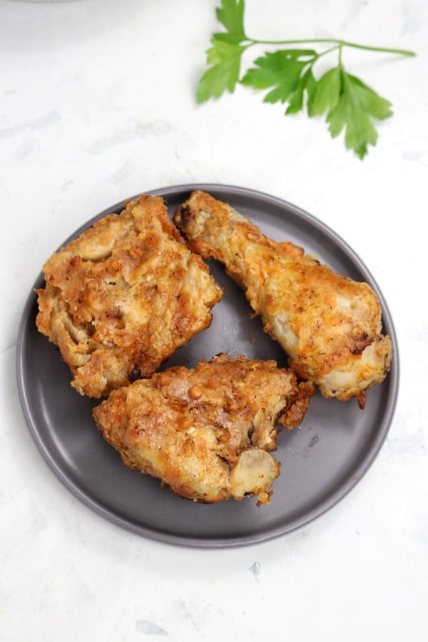 3pieces of Air fryer fried chicken served on grey plate.