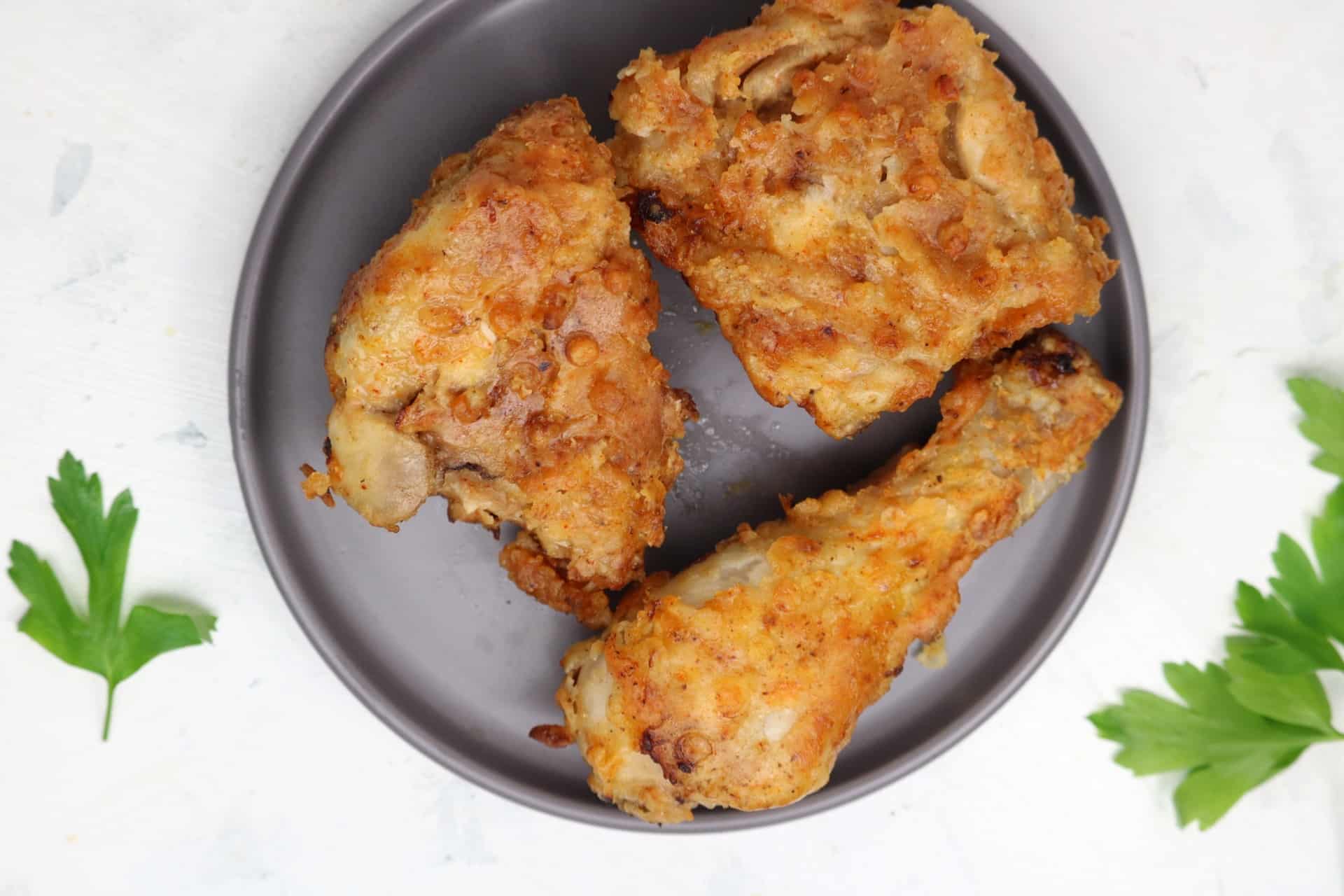air fryer southern fried chicken in grey plate.