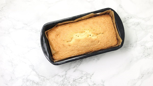 the baked cake in loaf pan.