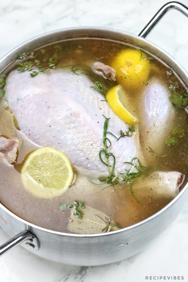 Turkey in brine inside a pot.