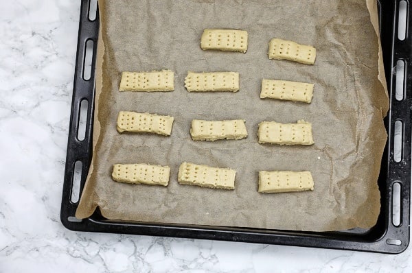 shortbread Dough shaped into rectanglar shapes and placed on baking tray.