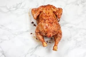 Marinated chicken displayed.