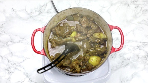 cooked curry goat in a pot.