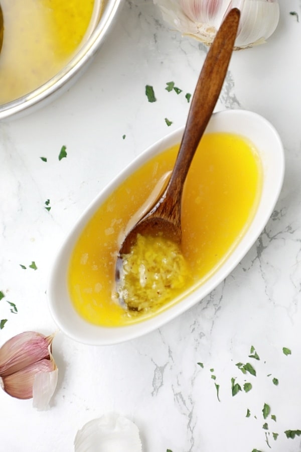 Garlic butter sauce in a sauce bowl.