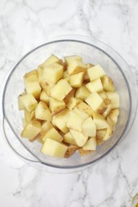 Cubed diced potatoes in a bowl.