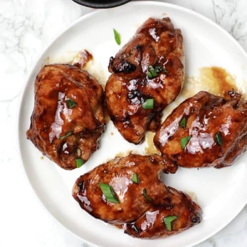 the chicken thighs served on a plate.