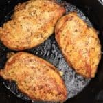 3 chicken breasts in a skillet.