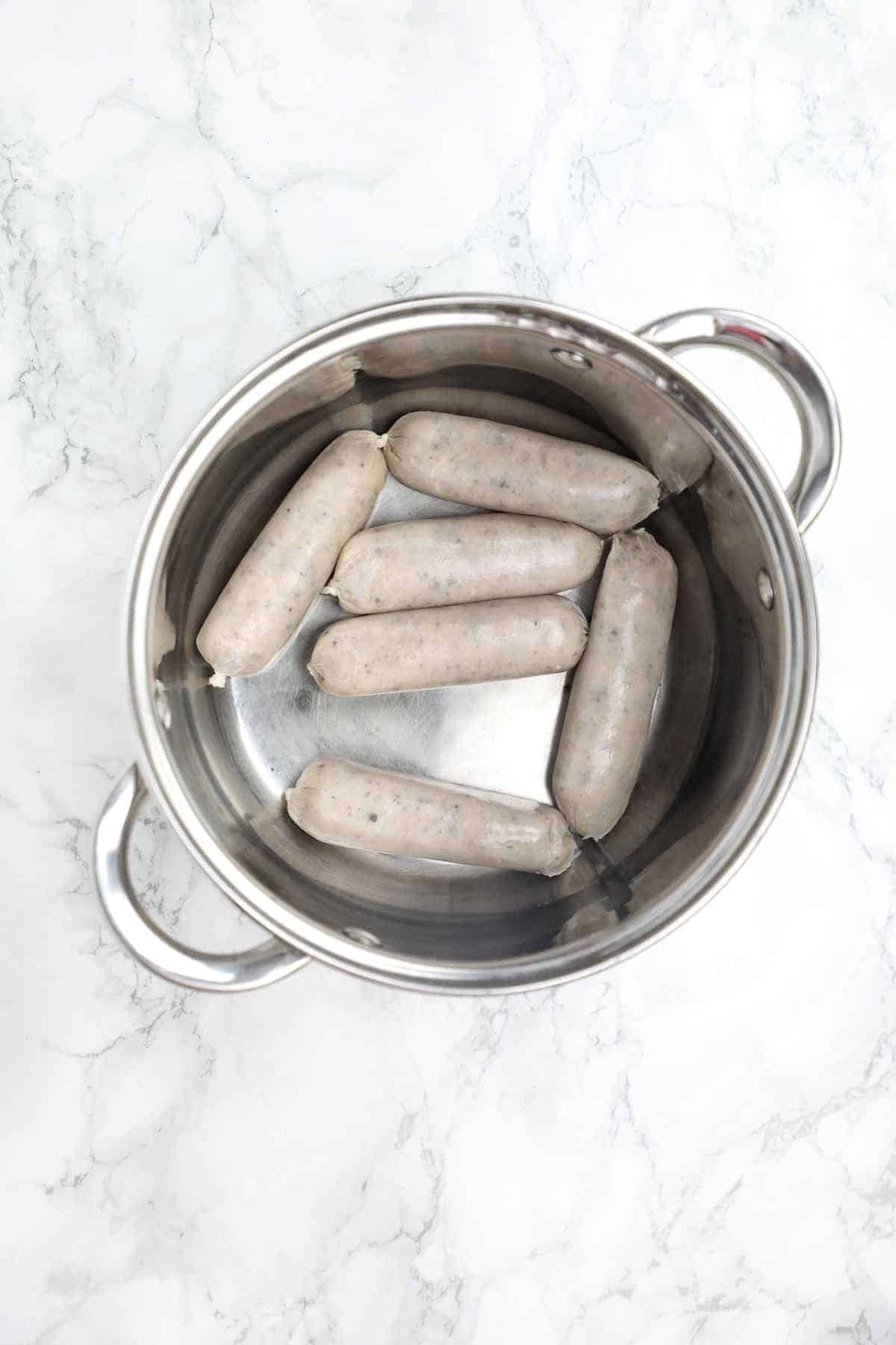 sausages in a pot.