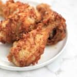 deep fried chicken legs on a plate.