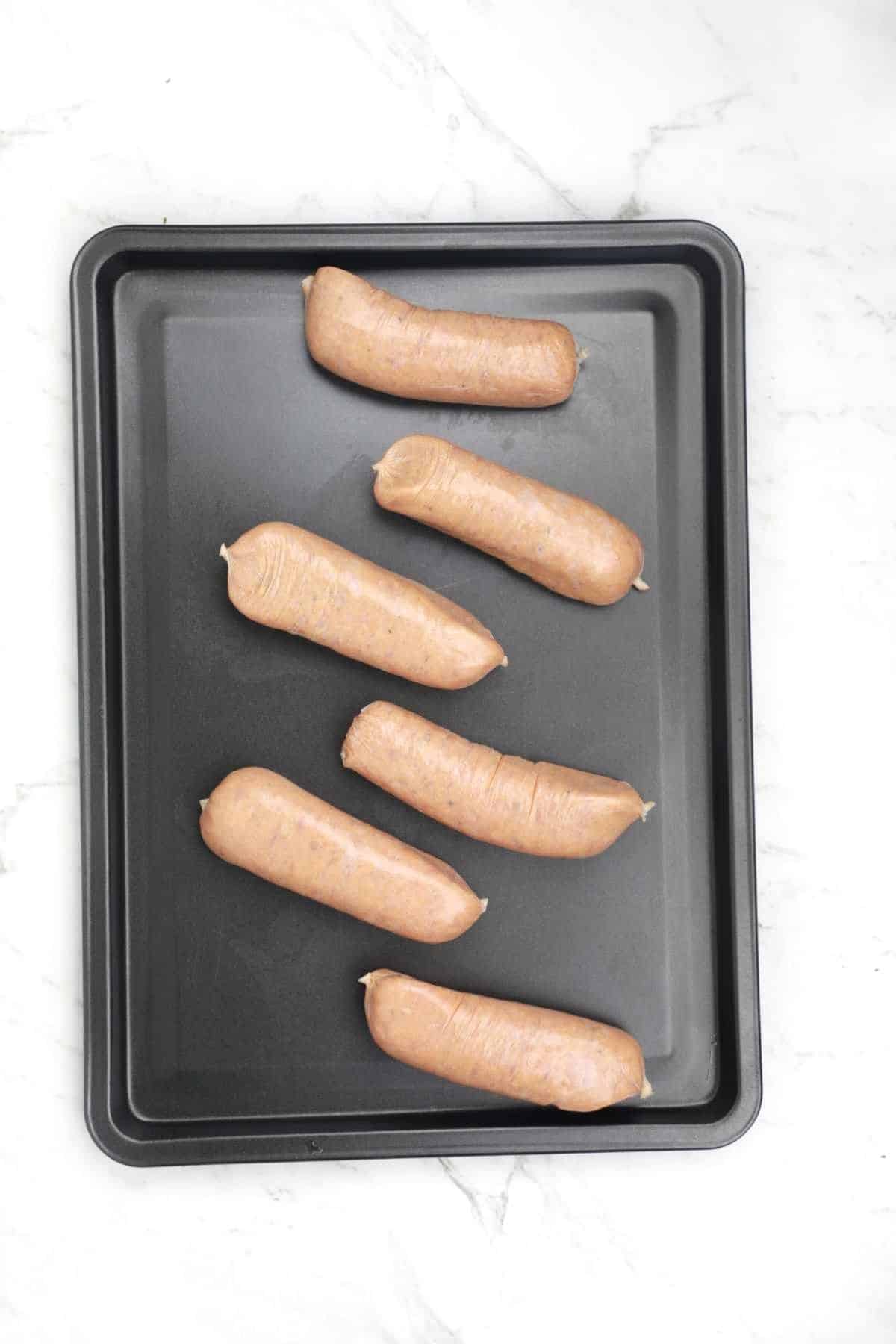 sausages on a baking tray.