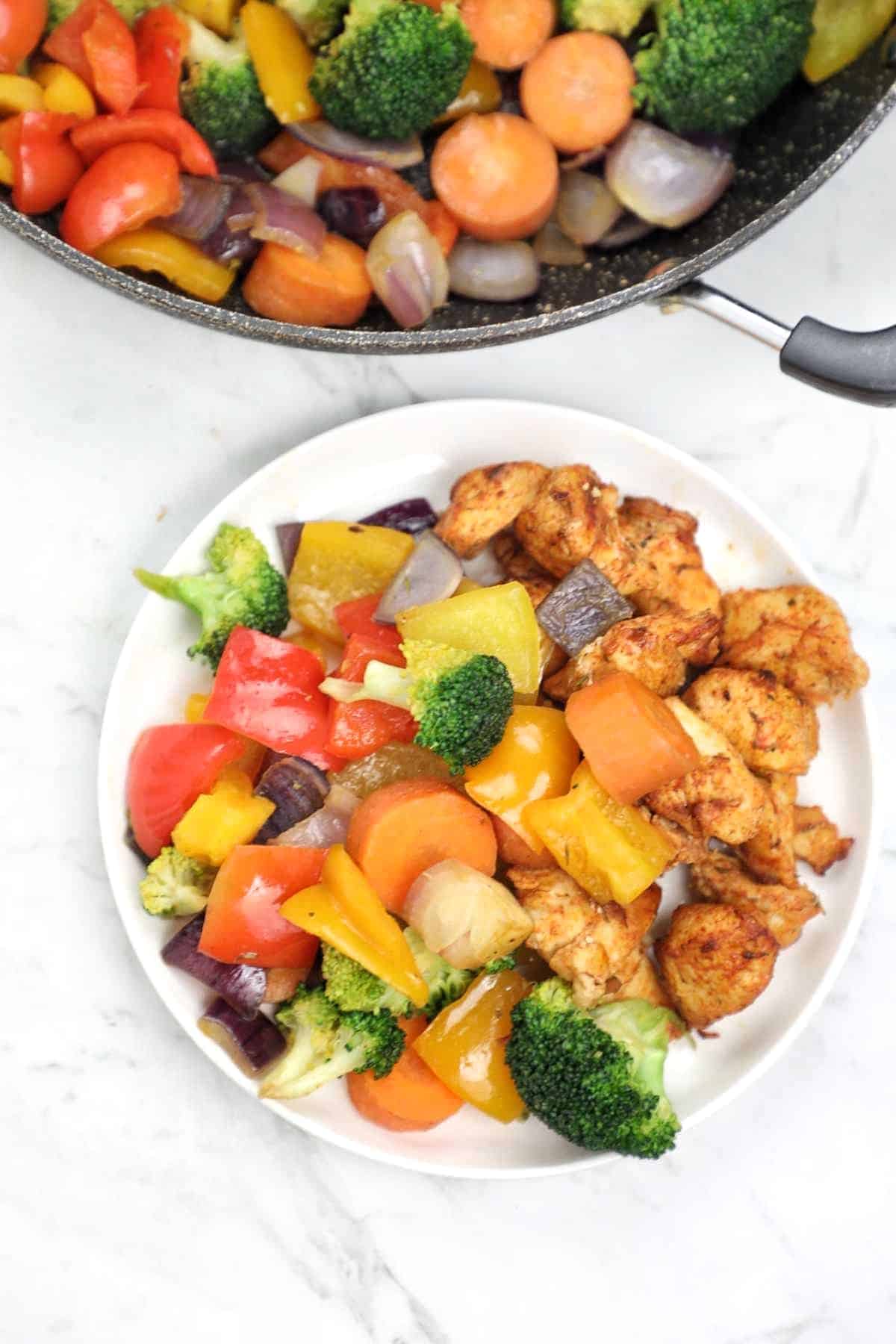 pan fried vegetables served with chicken.